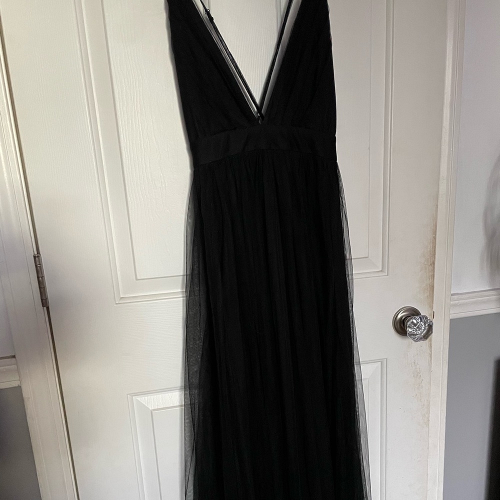 Floor length flowy black prom dress, with a slit on each leg